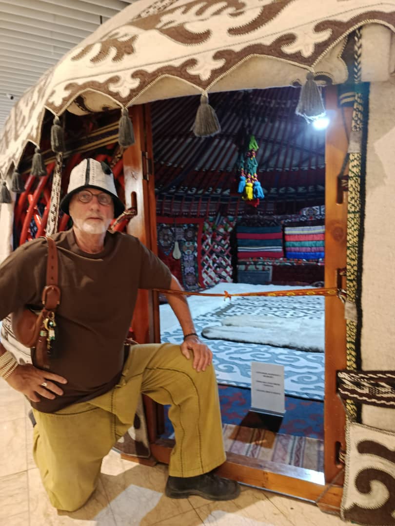 Yossi beside a museum-grade traditional Kyrgyz boz üy, fully decorated
